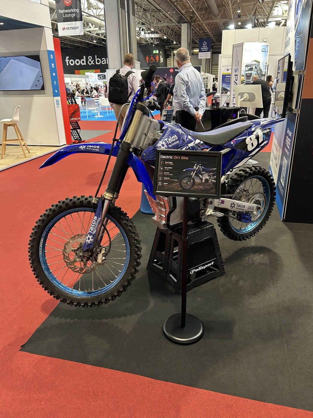 Electric off-road motorcycle incorporating Dual Flux Technology™ on the Talos stand