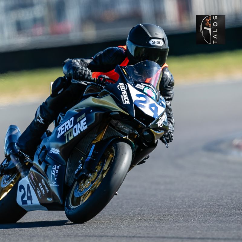 Evan racing the #24 Zero To One bike on track